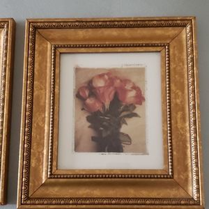Set of 2 pictures in beautiful gold frames.